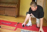 Marty Schabel installing laminate flooring
